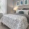 a bedroom with a bed and a chair