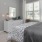 a bedroom with a bed and a desk