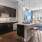 a kitchen with black cabinets