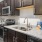 a kitchen with black cabinets