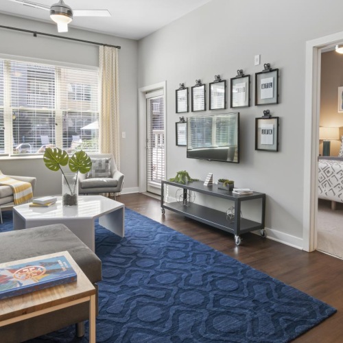 Beautiful living spaces with natural lighting a bedroom with a bed and a couch
