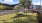 a playground with a fence and trees