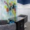 a room with a painting on the wall