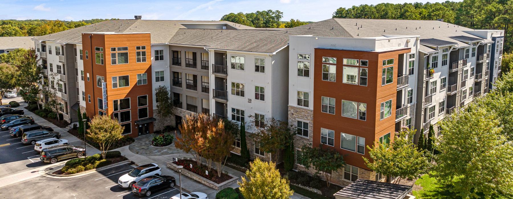 a building with cars parked in front